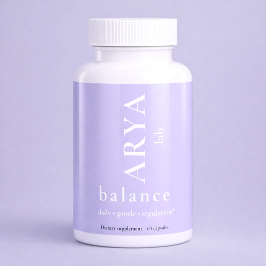 Supplement bottle labeled 'ARYA lab balance' on a light purple background