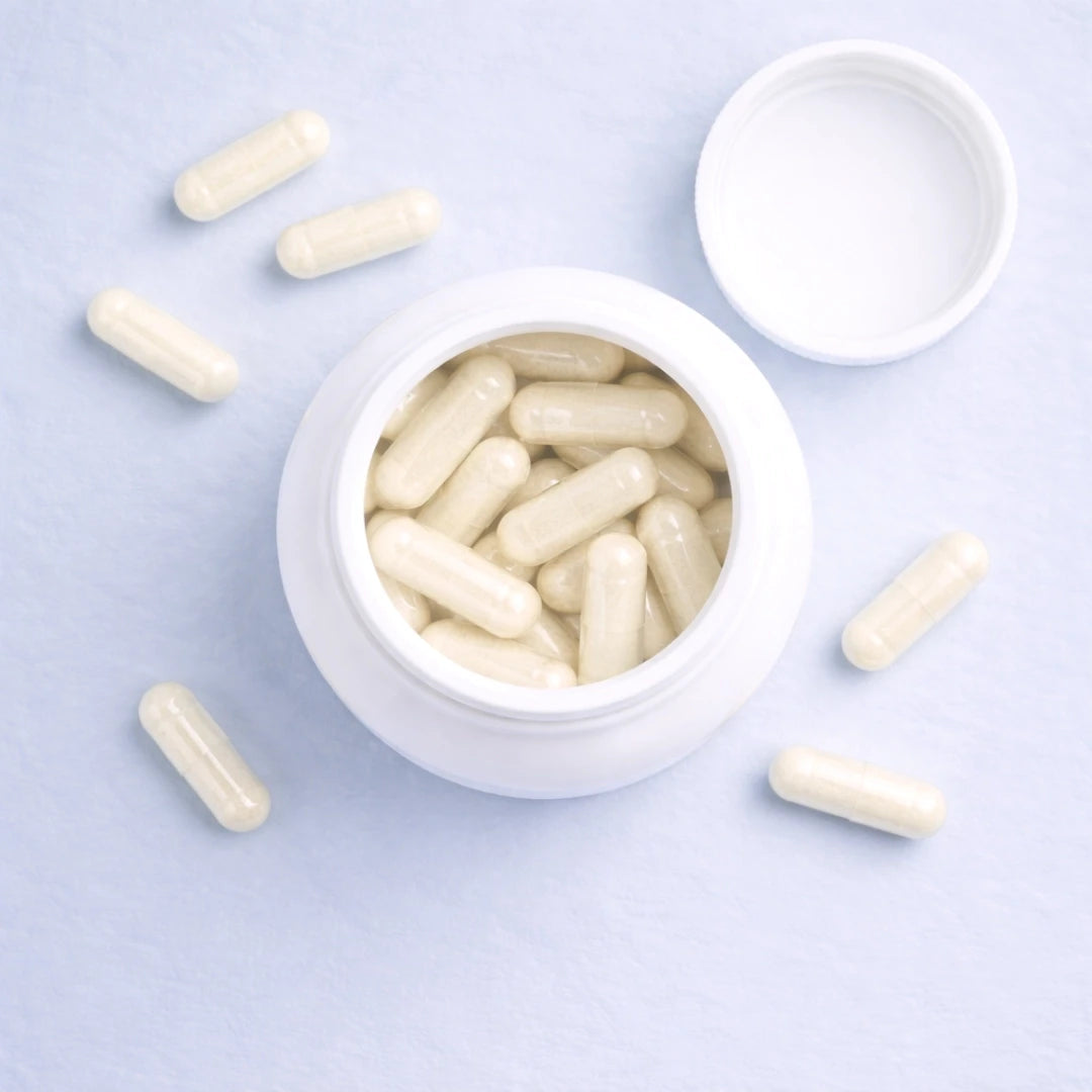White capsules of Calm by ARYA Lab in an open white container on a light purple background