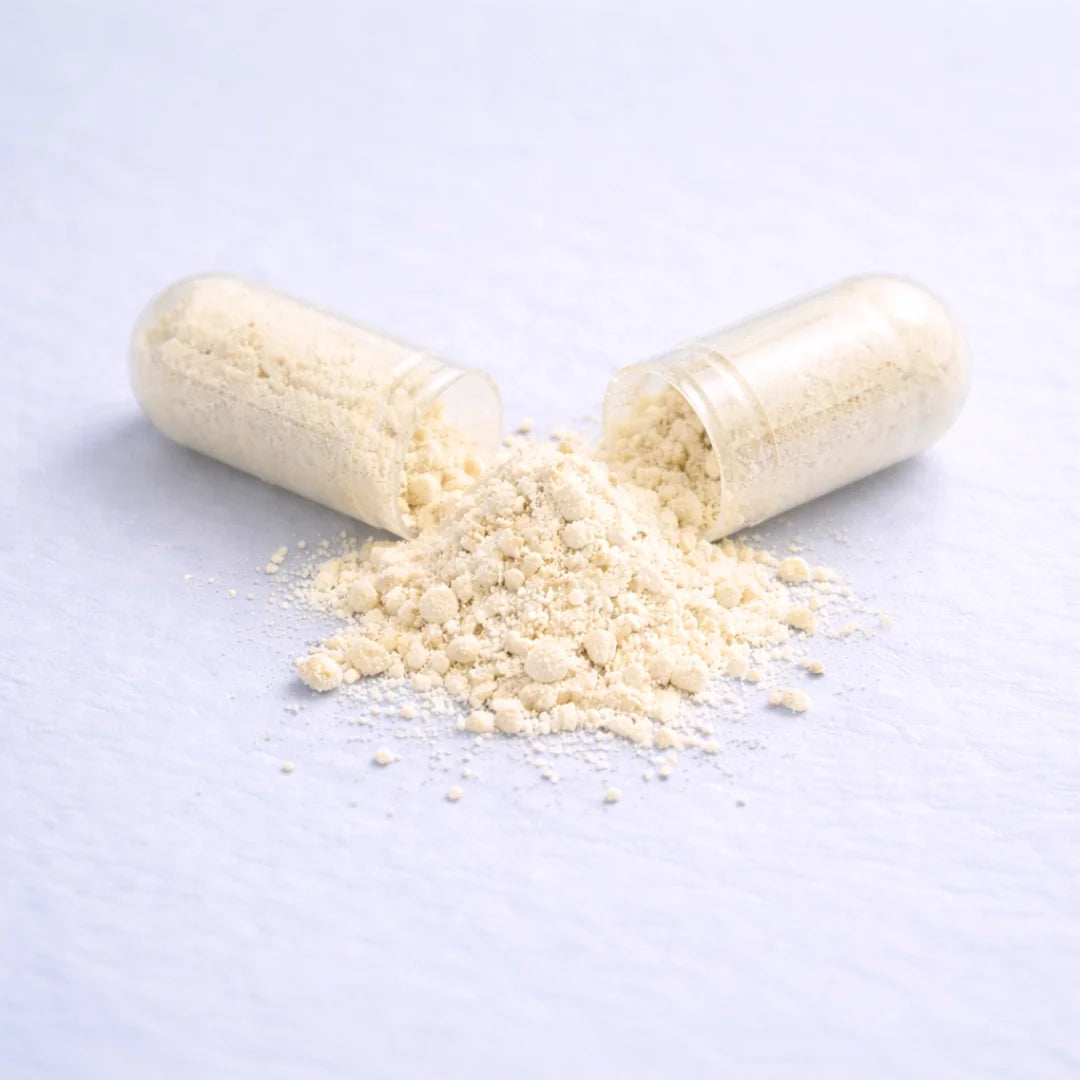 A capsule of Calm by ARYA Lab with its contents spilling out on a light blue background