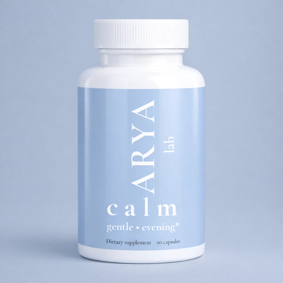 Supplement bottle labeled 'ARYA lab calm' on a light blue background