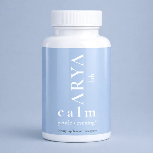 Supplement bottle labeled 'ARYA Lab Calm' on a light blue background