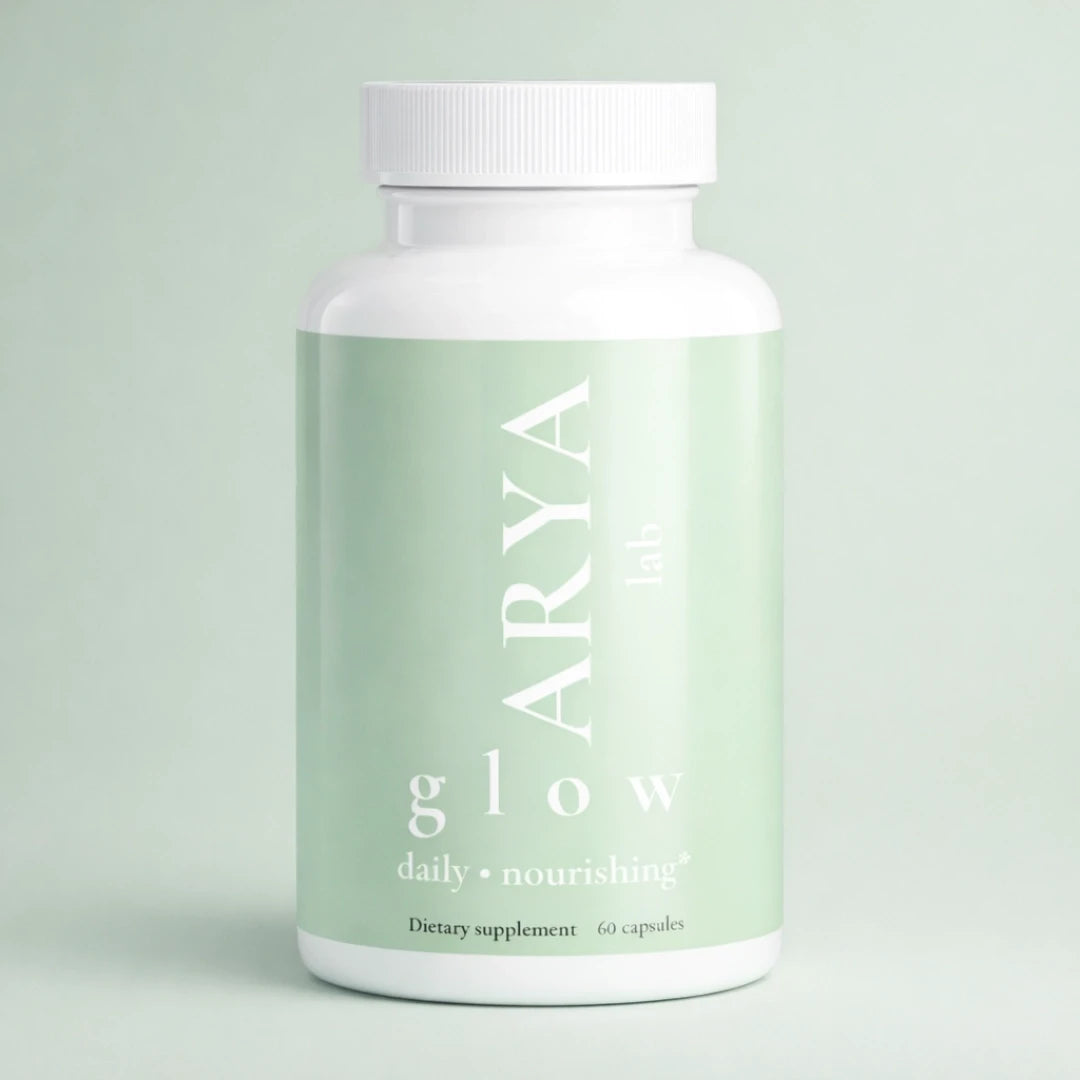 Supplement bottle labeled 'ARYA glow' on a light green background