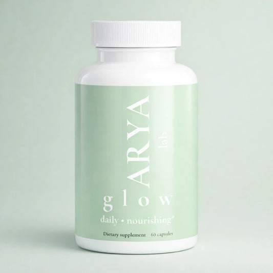 Supplement bottle labeled 'ARYA glow' on a light green background
